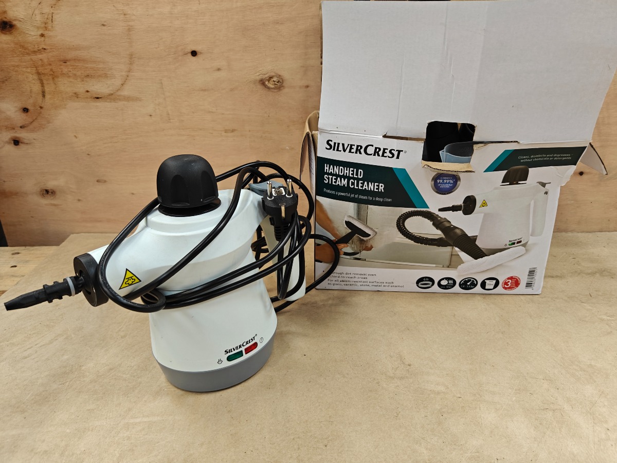 hånd holdt damprenser