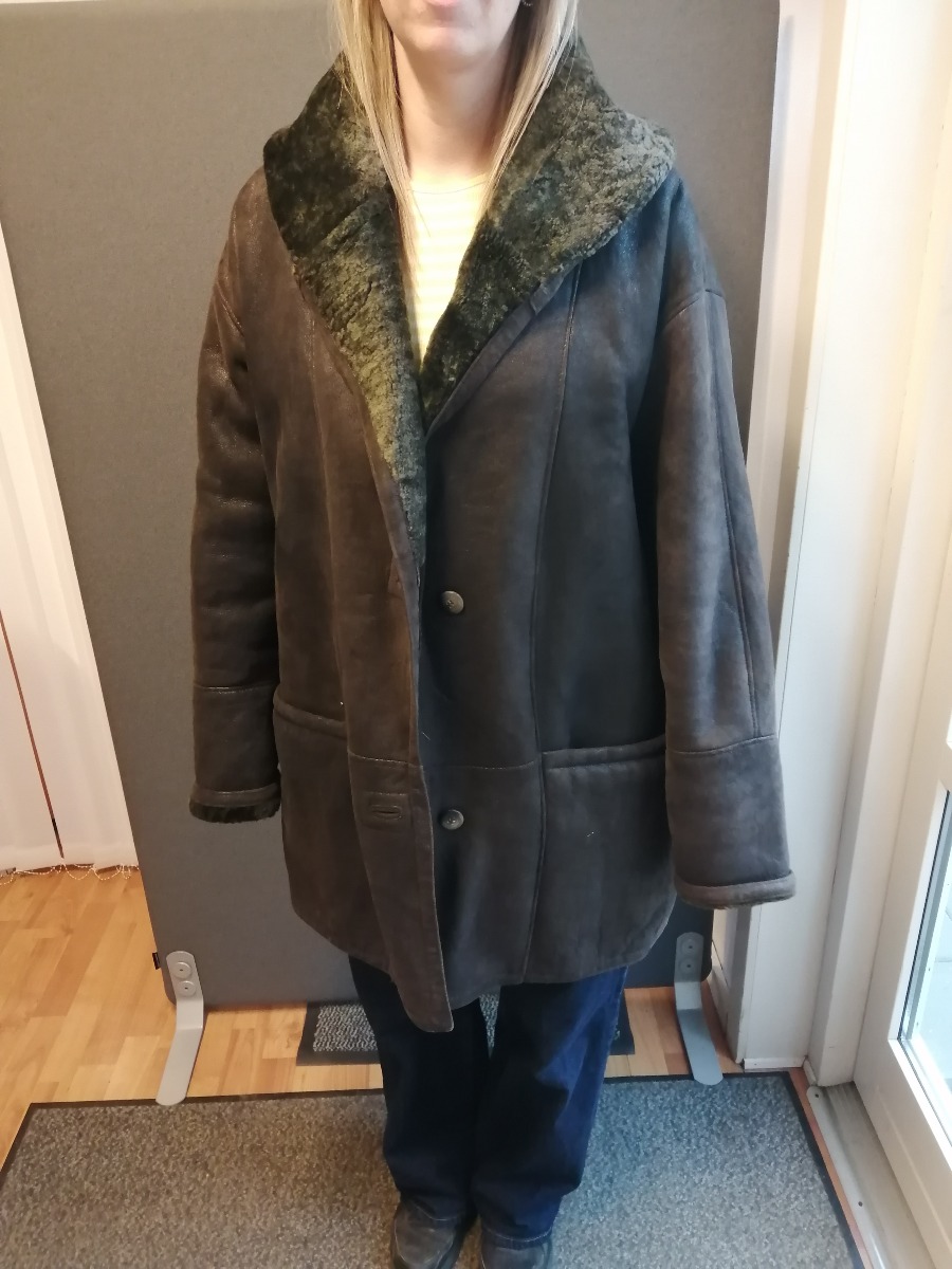 Rulamsfrakke med hætte. 